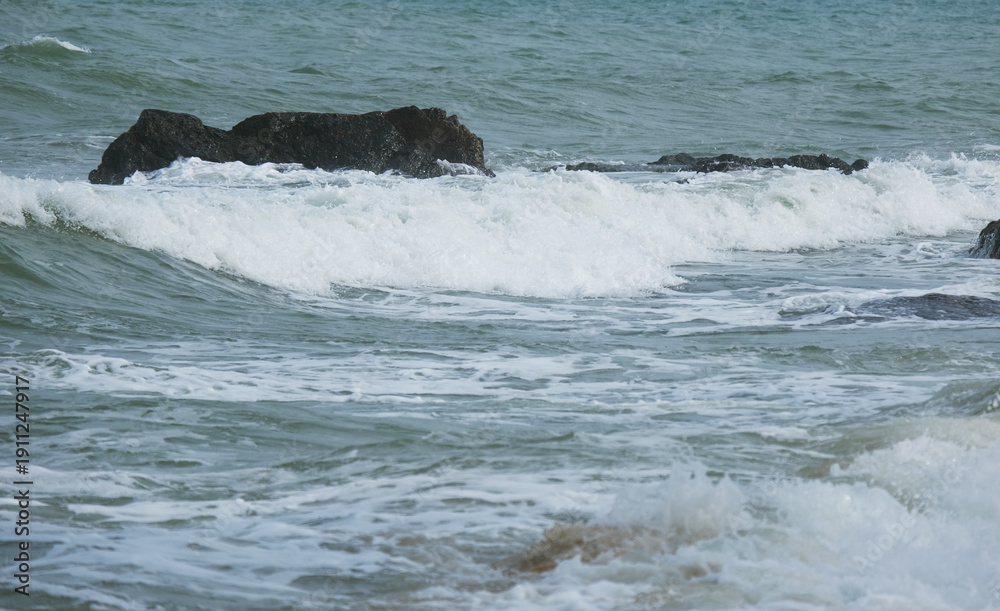 Fototapeta premium High surge of the ocean. Big waves during the monsoon particularly during the Northeast Monsoon november till march in Malaysia and South Asia