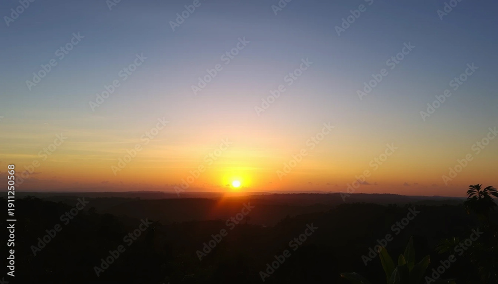 Fototapeta premium Calm radiant sunset above jungle sky