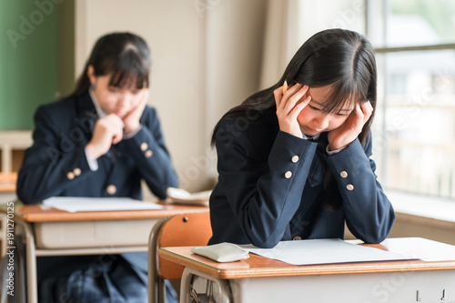 Obraz na plátně High school, junior high school, and elementary school girls taking exams and te
