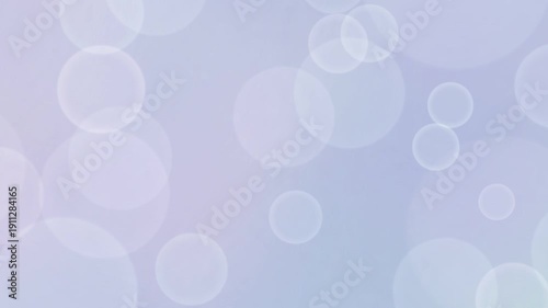 Smoothly animated abstract background featuring large soft white bokeh circles floating across a gentle pastel light purple gradient backdrop. Creates a dreamy, elegant, and airy atmosphere