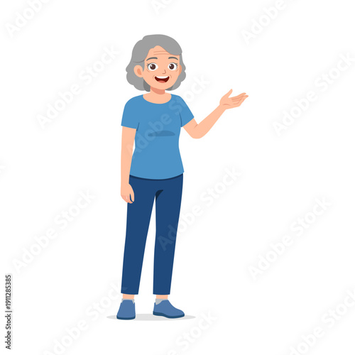 An elderly woman standing smiling and presenting with her hand looking friendly and happy with positive emotion