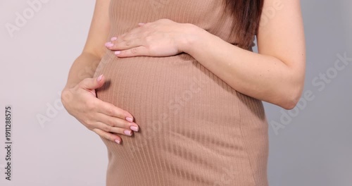 Wallpaper Mural Pregnant woman touching her belly on light grey background, closeup Torontodigital.ca