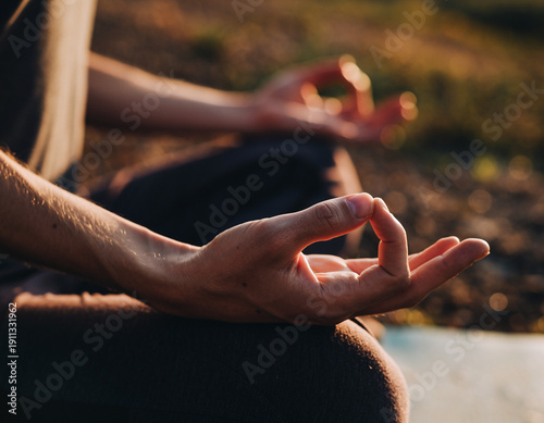 Detailed Close-up of Hands in Jnana Mudra During Sunset Meditation Outdoors