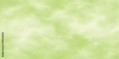 A soft abstract green bokeh background features bright summer sun light and blurred nature patterns for a shiny spring wallpaper design