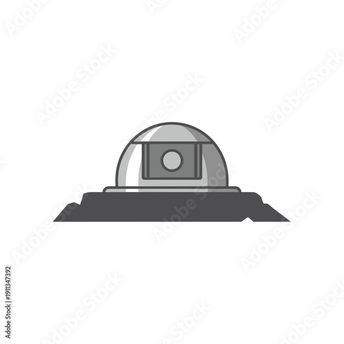 Road sensor stud embedded in asphalt for traffic monitoring and smart highway data.