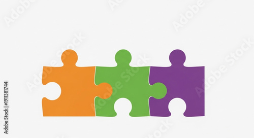 Three colorful puzzle pieces connected together representing teamwork.