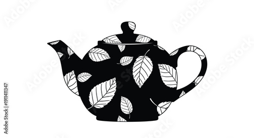 Elegant teapot adorned with leaves in a striking black silhouette