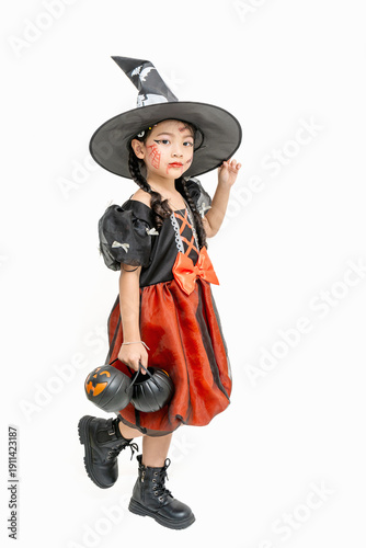 Asian girl dressed up for Halloween posing for a photo on a white background.