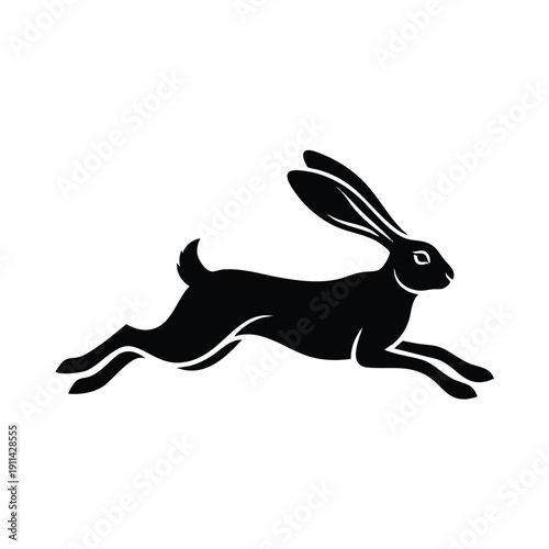 Silhouette of a running hare in midleap.