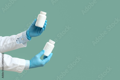 Hands of doctor with pill b...