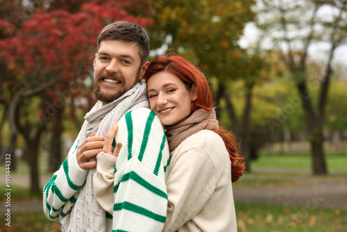 Cute young couple in warm s...