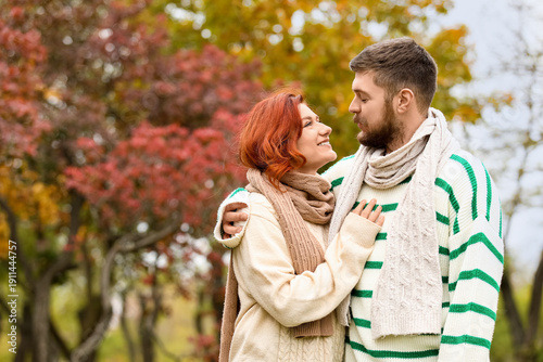 Cute young couple in warm s...