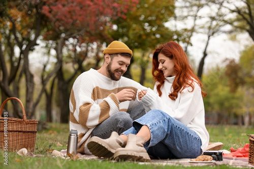 Cute young couple in warm s...