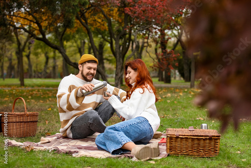 Cute young couple in warm s...