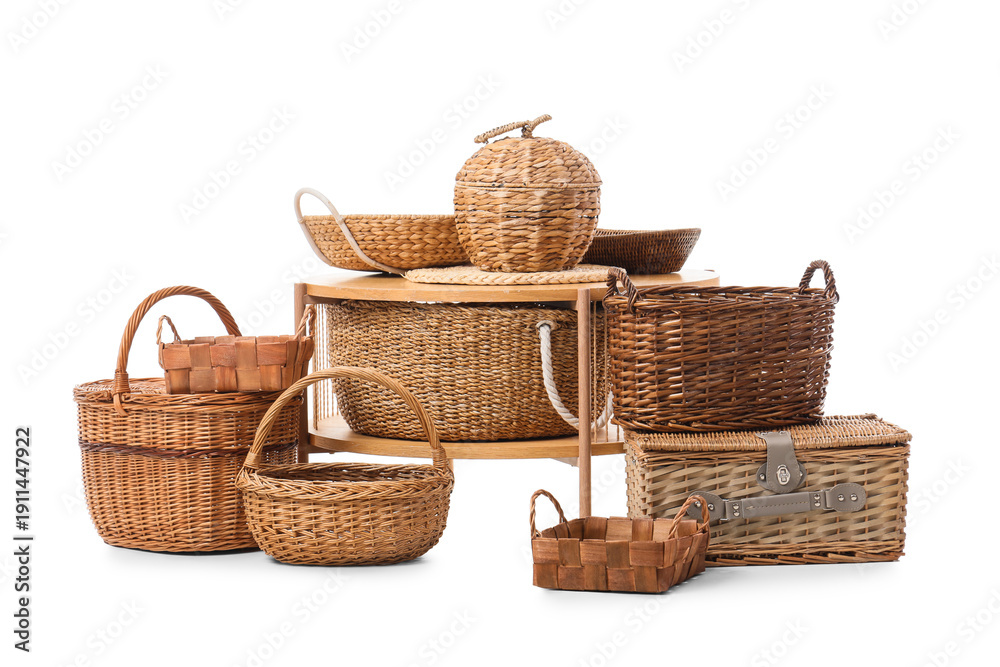 Obraz premium Coffee table and different wicker baskets isolated on white background