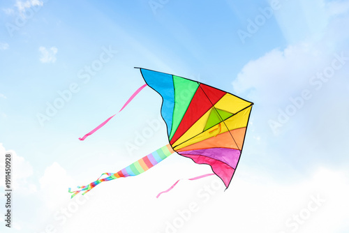Colorful kite flying in blu...