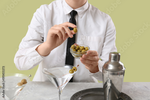Female bartender making tas...