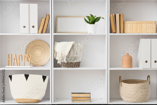 Books with plants, decor an...