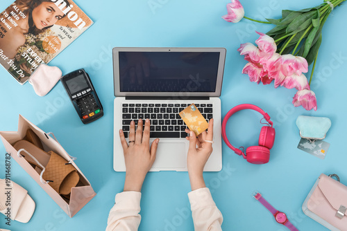 Female hands with laptop an...