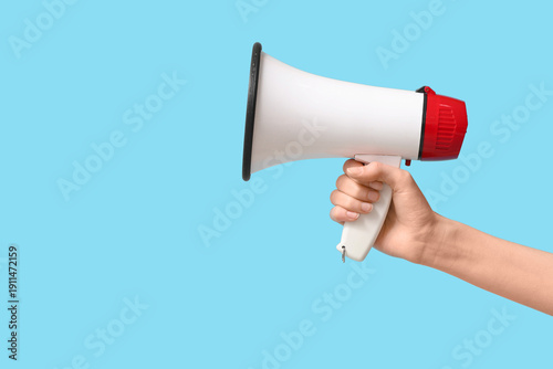 Female hand with megaphone ...