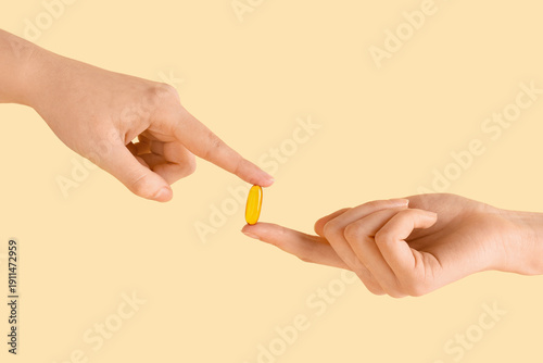 Female hands with fish oil ...