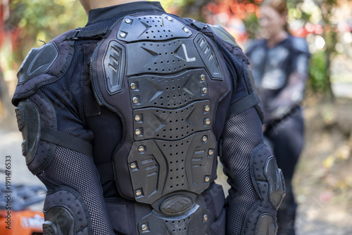 Fotografía Focused biker wearing black back protector armor and gear for motorcycle motocross sport