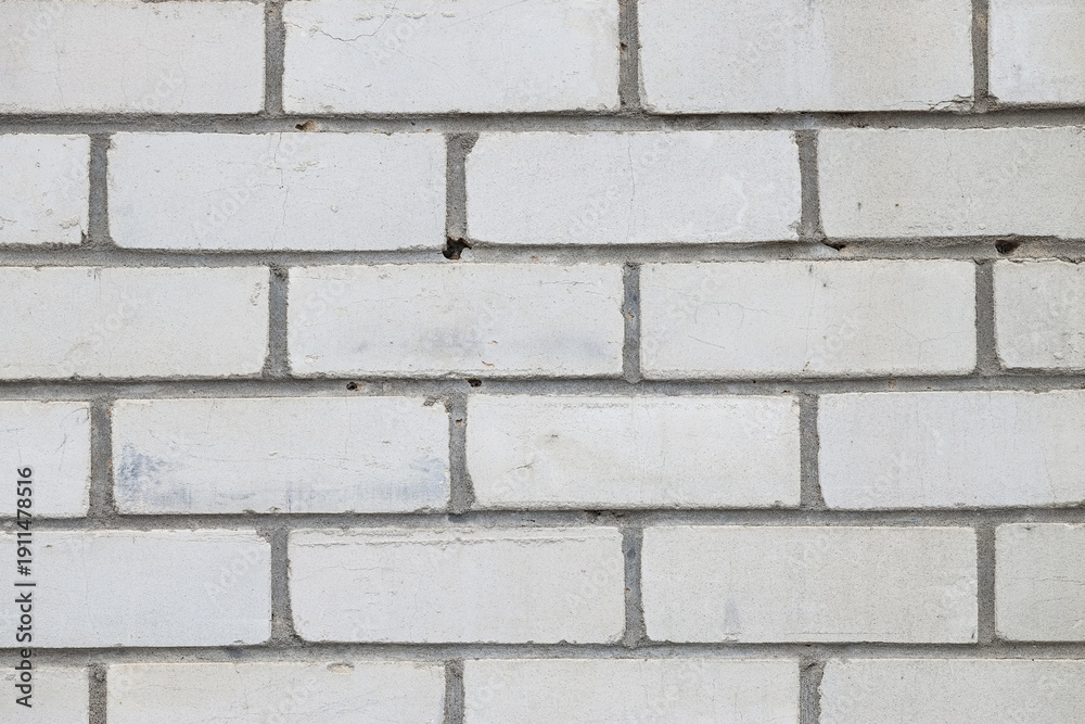 Fototapeta premium Texture of white brick wall as background, closeup