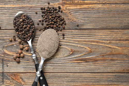 Spoons with black pepper po...