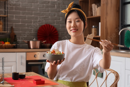 Young Asian woman with tast...