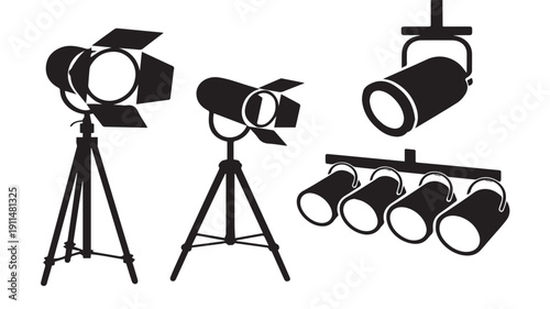 Various spotlights and stage lighting equipment on tripod stands