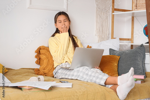 Sleepy teenage Asian girl w...