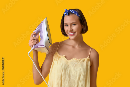 Smiling young woman holding...