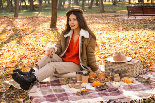 Young happy Asian woman wit...