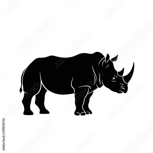A striking black silhouette of a rhinoceros standing in profile