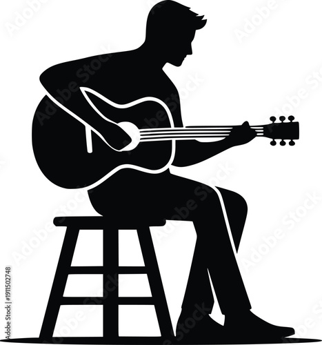 Silhouette of a person sitting on a stool and playing a guitar