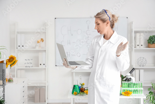 Female scientist with flask...