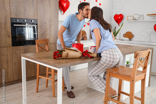 Happy young couple kissing ...