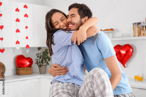 Happy young couple hugging ...