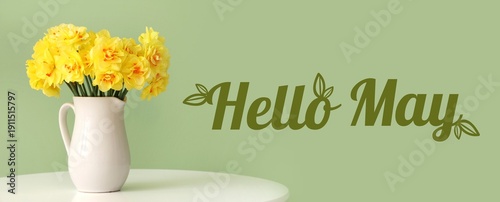 Daffodil flowers in jug on ...
