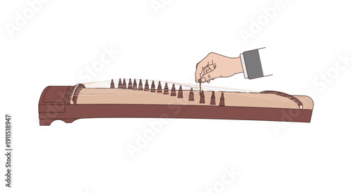 Hand playing a musical instrument dulcimer.