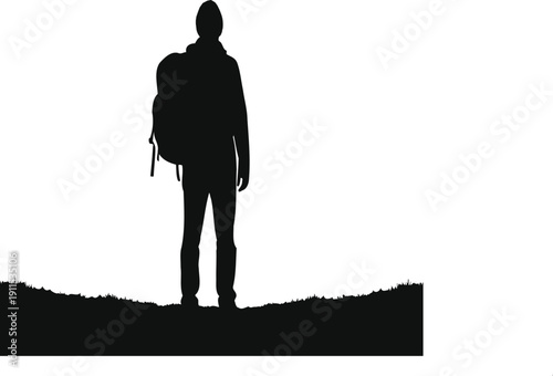 A lone traveler stands on a hill with a backpack