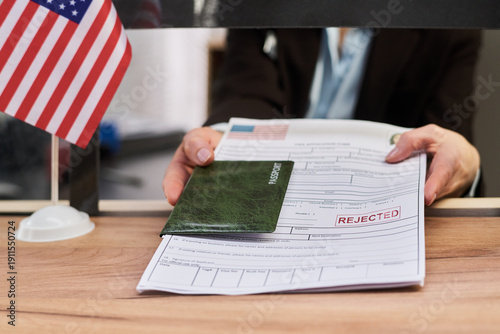 Φωτογραφία Caucasian middle aged woman handing over passport and visa application form with