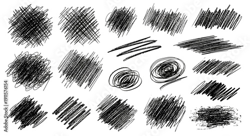 Collection of various black sketch strokes and spirals on plain background viewed from directly above