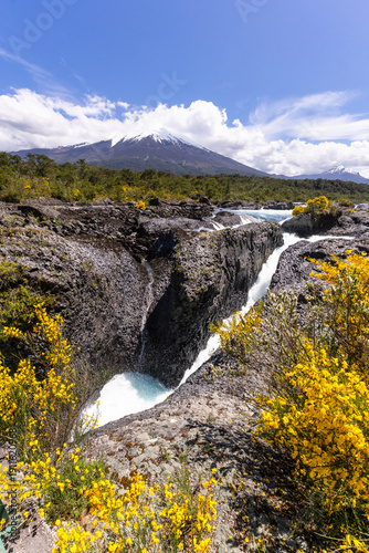 Puerto Varas, Chile: The famous Petrohue waterfall situated near Puerto Varas in Lake District of Chile with Osorno volcano covered with cloud on sunny day