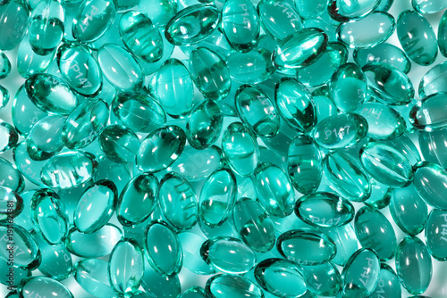 Blue capsules in the shell with liquid vitamin. Blue capsules with a dietary supplement for joints teeth and bones