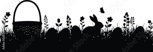 Black silhouette of easter bunny sitting among decorated eggs and wild flowers with butterfly and empty woven basket in grass landscape vector art