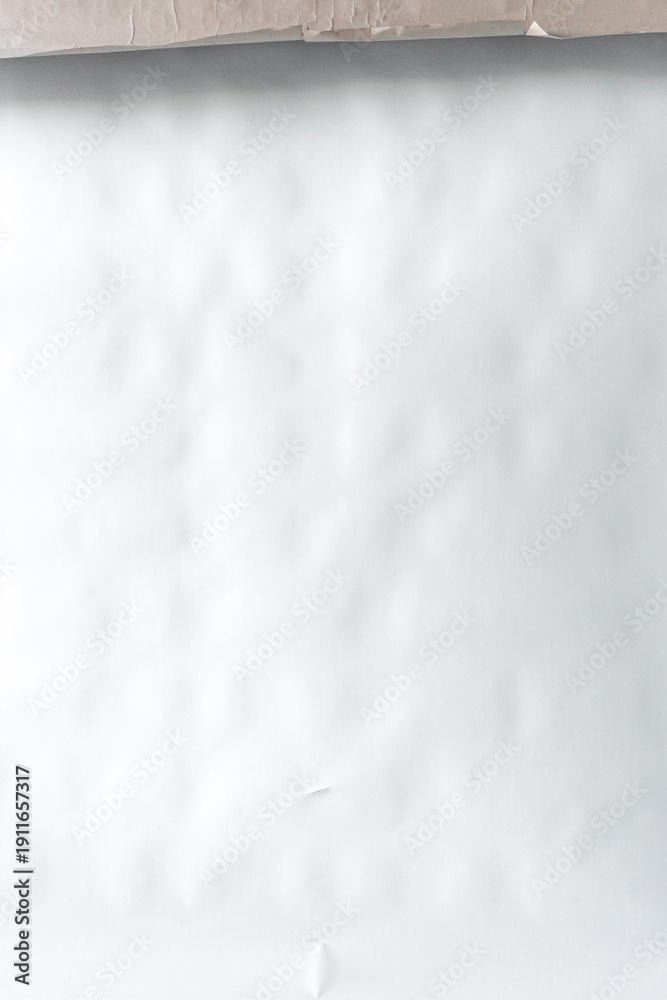 Obraz premium Minimalist white matte textured backdrop. White crumpled paper texture background. Abstract light wrinkled paper surface with subtle highlights.