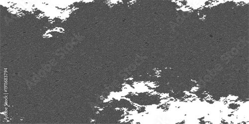 A grungy black and white painted asphalt texture creates a rough, dirty surface for a vintage background design