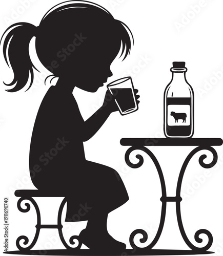 Little girl drinking glass of fresh milk at table with glass bottle