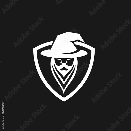 Stylized Wizard or Sorcerer Head with Pointed Hat and Long Beard in Shield Emblem Logo